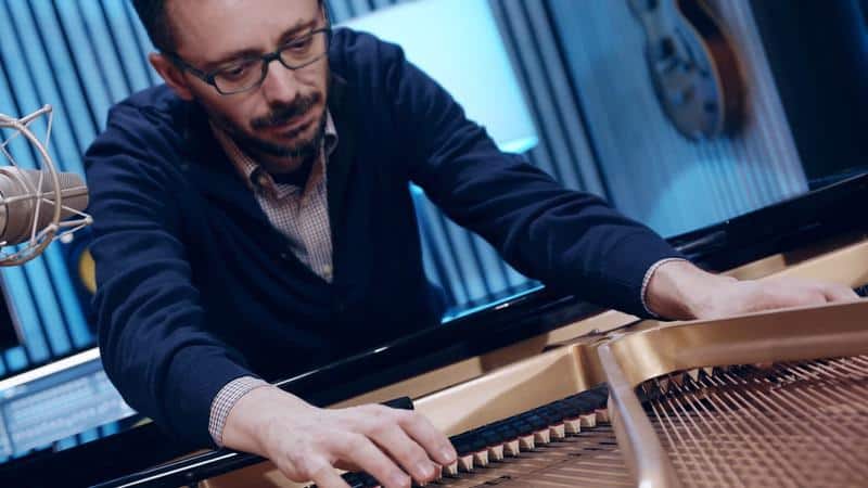 alessandro ponti in a sound experimentation with the piano strings